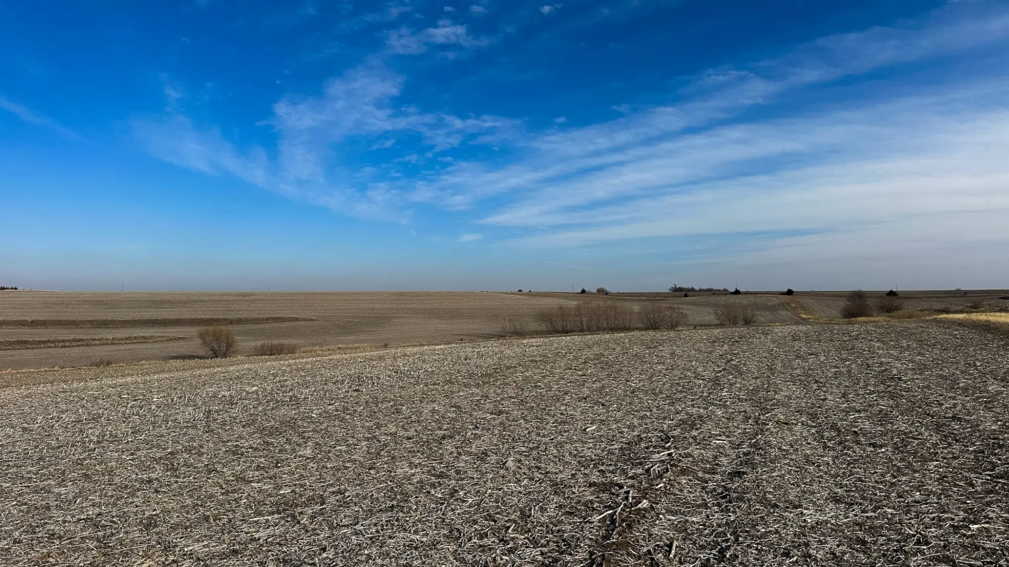 a bird's eye view of farmland in Fremont County, Iowa. The sky is clear.