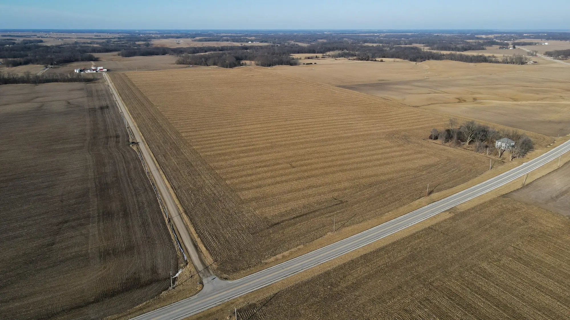A bird's-eye view photo of Fulton County, Illinois farmland reveals a blue sky.