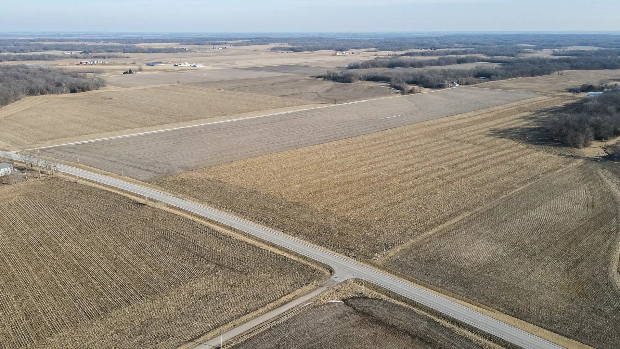 A bird's-eye view photo of Fulton County, Illinois farmland reveals a blue sky.