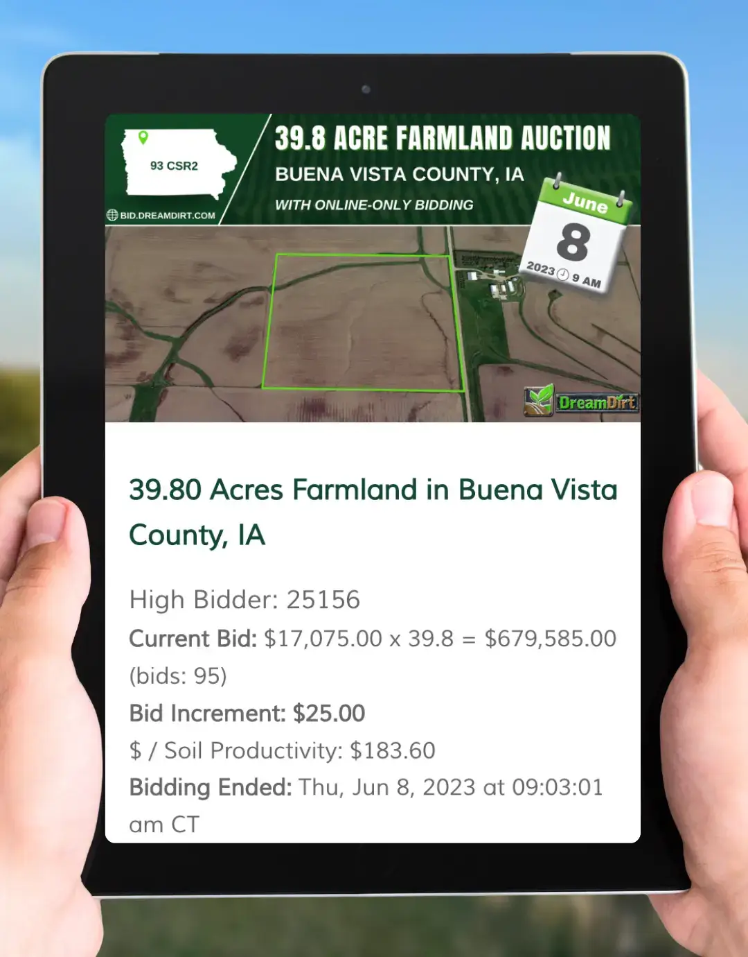 two hands hold a tablet. on the sceen of the tablet, an farmland online auction hosted by DreamDirt preview is displayed with bidding information
