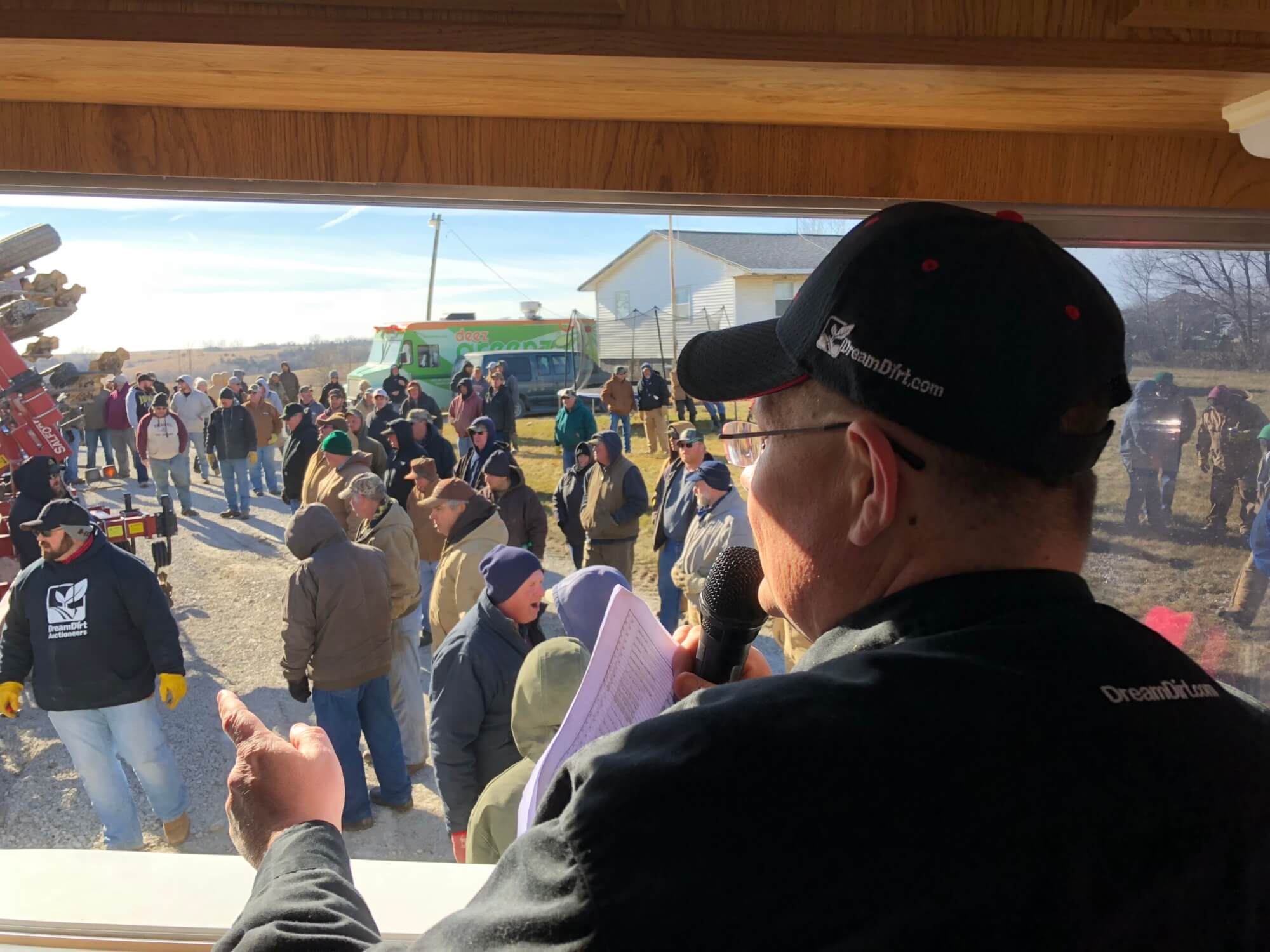 auctioneer with crowd of people